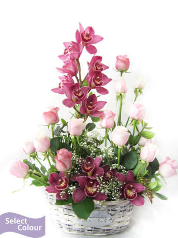 Roses and orchids in woven basket