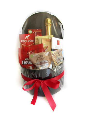 Sparkling juice, chocolates and nuts wrapped in gift box