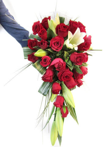 Red roses and lilies in bridal bouquet